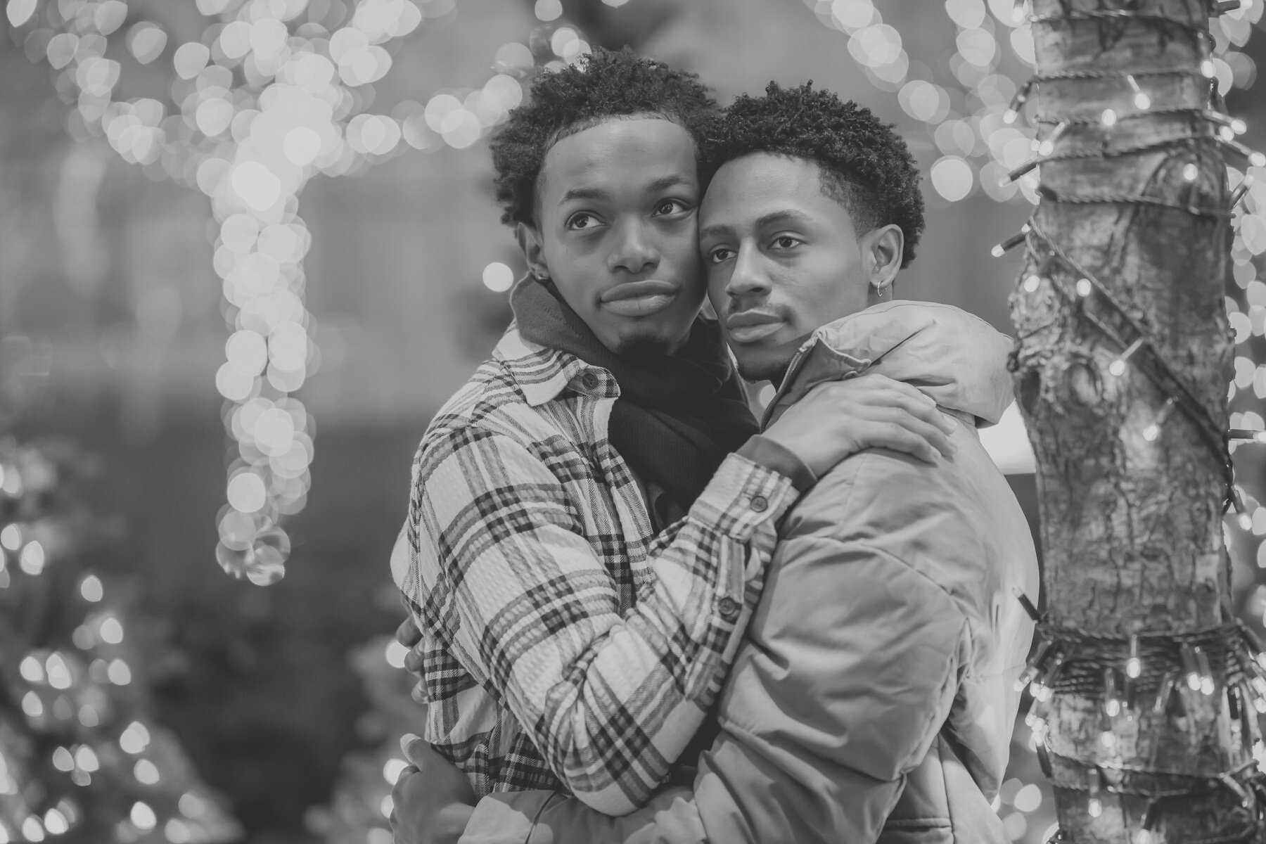 Romantic black gays hugging on street